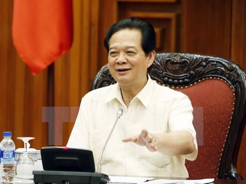 Prime Minister Nguyen Tan Dung urges to ensure macro economy, currency stability - ảnh 1